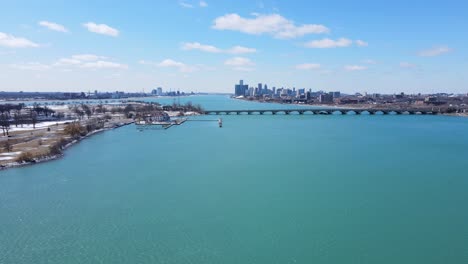 Long-bridge-to-Belle-Isle-and-Detroit-skyline,-aerial-view