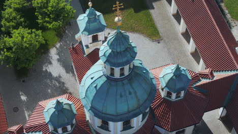 Orbiting-Aerial-View-of-Dome-of-Church-of-Our-Lady-Victorious,-Bílá-Hora,-Prague,-Czech-Republic