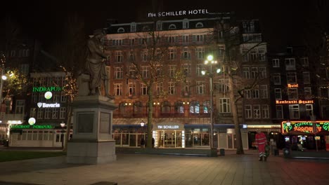 Night-time-city-view-at-Rembrandtplein-with-Schiller-Hotel-in-the-background