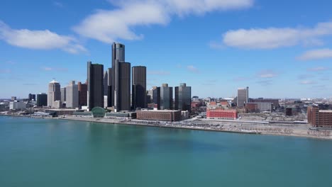 Downtown-Detroit-with-the-Renaissance-Center-in-winter,-aerial-ascend-view