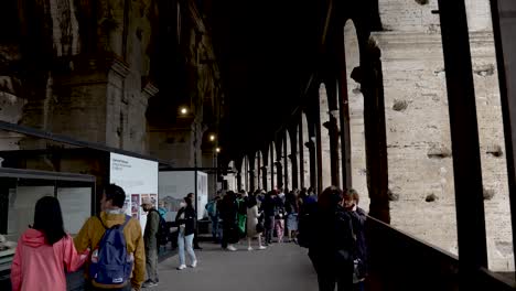 Tourists-Walking-And-Exploring-Inside-The-Colosseum-Checking-Out-Exhibitions-Showcasing-Artefacts
