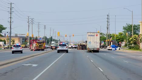 Police-And-Emergency-Vehicles-Attending-Scene-Of-Road-Traffic-Accident-Ontario,-Dolly-Right-Shot
