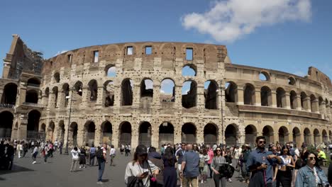 Tourists-Walking-Around-The-Colosseum-On-Sunny-Day-In-Rome