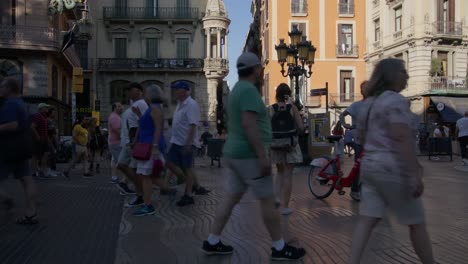 Close-up-of-Tourists-Walking-in-Shadows-on-Crowded-Street-at-Sunset-In-Barcelona-Spain-in-6k
