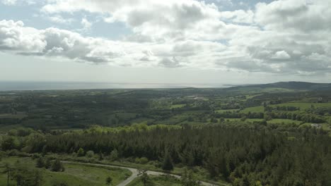 Evergreen-Countryside-Nature-Overlooking-Seascape-In-Wicklow-County,-Ireland