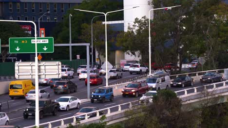 Rush-hour-off-work-peak-period-capturing-heavy-vehicle-traffics-on-M3-Pacific-Motorway-in-Brisbane-city,-bottleneck-traffic-congestion-on-riverside-expressway,-static-shot