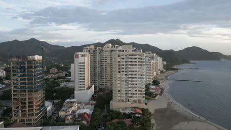 Drone-Shot-of-Santa-Marta-Colombia-Waterfront-Buildings-Along-Caribbean-Sea-Coastline