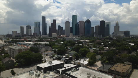 Houston,-Texas-Skyline-Aerial-with-Downtown-Buildings-in-Silhouette-Against-Bold-Clouds