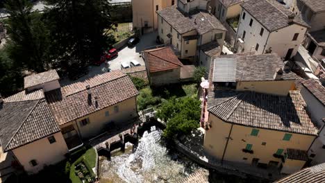 Aerial-Flying-Overhead-Rasiglia,-A-Small-Village-Located-In-The-Province-Of-Perugia