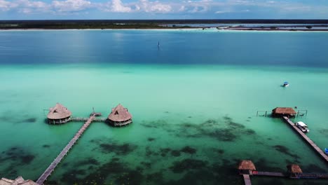 aerial-view-of-luxury-resort-on-tropical-sandy-beach-lagoon-in-Bacalar-Mexico-Quintana-Roo