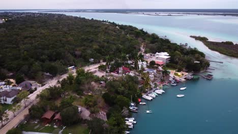 drone-above-Bacalar-Mexico-travel-holiday-destination-with-green-jungle-and-tropical-sandy-beach