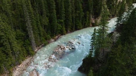 Aerial-view-overlooking-rocky-rapids-at-the-Blaeberry-river,-in-sunny-BC,-Canada