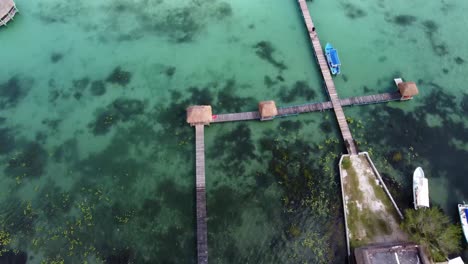 aerial-top-down-view-of-fancy-luxury-resort-in-Bacalar-Mexico-Quintana-Roo-state-with-stunning-blue-clear-water-lake-lagoon
