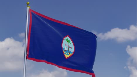 Flag-Of-Guam-Moving-In-The-Wind-With-A-Clear-Blue-Sky-In-The-Background,-Clouds-Slowly-Moving,-Flagpole,-Slow-Motion