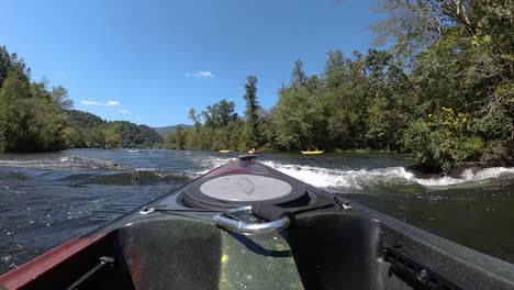 Slow-motion-POV-kayak-getting-splashed-on-the-river