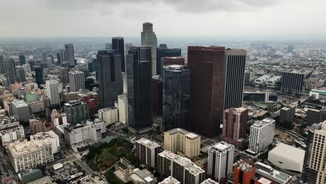 Aerial-view-circling-around-downtown-Los-Angeles,-cloudy-day-in-California,-USA