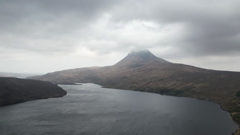 Hyperlapse-of-moving-clouds-over-the-mountain’s-peak-and-the-lake-in-Scottish-Highlands