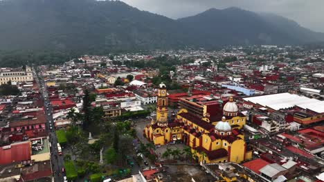 Aerial-view-backwards-over-the-Orizaba-Cathedral,-cloudy-day-in-Veracruz,-Mexico
