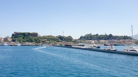 Arriving-at-Corfu-Greece-by-Ferry-Boat,-Old-City-Old-Port-and-Fortress-in-Background,-View-from-Ferry