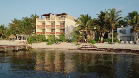Aerial-zoom-out-of-the-Alea-Hotel-in-Tulum-with-a-scenic-view-of-the-coastline