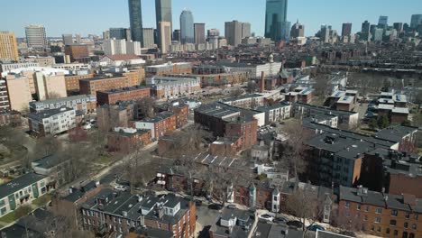 Aerial-Pan-Up-Reveals-Boston-City-Skyline-on-Picturesque-Day