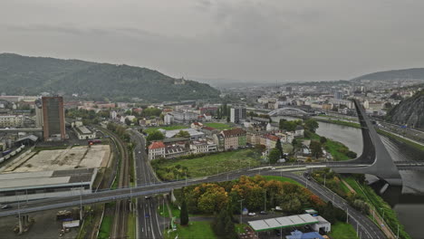 Usti-nad-Labem-Czechia-Aerial-v2-establishing-shot-drone-flyover-Strekov-towards-Mesto-capturing-cityscape-on-the-bend-of-Elbe-river-and-hillside-hotel-větruše---Shot-with-Mavic-3-Cine---November-2022