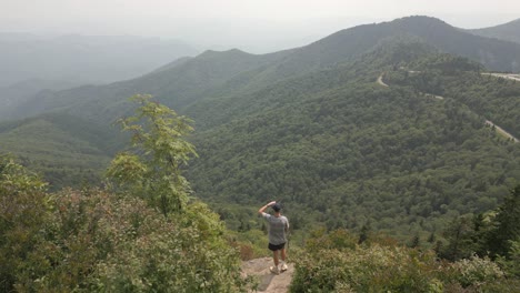 Young-man-enjoys-forest-valley-view-from-Smoky-Mountains-viewpoint