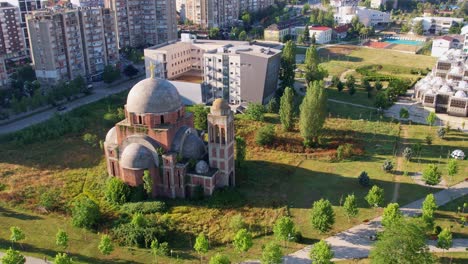 Aerial-of-center-Pristina,-Kosovo-with-Serbian-orthodox-church