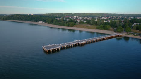 Aerial-View-Pier-And-Coastline-On-The-Idyllic-Baltic-Sea-In-Orlowo-During-Sunrise-In-Gdynia