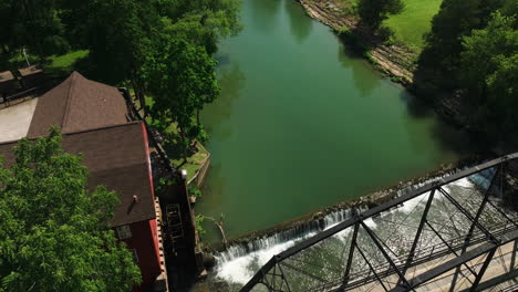 Historic-War-Eagle-Mill-building-seen-from-above-the-bridge-in-Rogers,-Arkansas