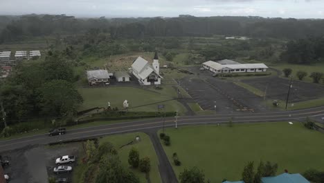 Misty-aerial-over-Sacred-Heart-Church-in-Pahoa-on-Big-Island,-Hawaii