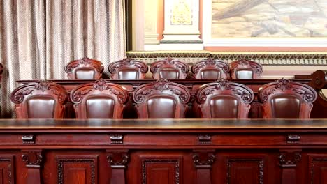 Wooden-chairs-and-furniture-in-the-Presidential-Room-of-Palacio-da-Bolsa,-Porto,-Portugal