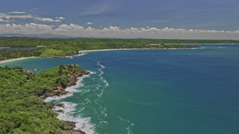 Kudawella-Sri-Lanka-Aerial-v2-cinematic-drone-fly-around-rocky-shore-capturing-Hummanaya-blow-hole,-sandy-beach,-bay-harbor-and-Indian-oceanscape-in-exotic-summer---Shot-with-Mavic-3-Cine---April-2023