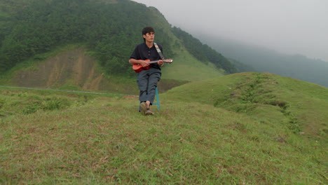 Asian-musician-plays-Ukulele-and-sings