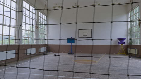 Slide-shot-across-volleyball-net-reveals-spacious-Bulgarian-school-gymnasium-Petko-Slaveikov