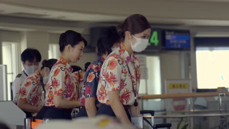 Japanese-woman-crew-bow-before-boarding-at-Okinawa-Naha-Airport-Japan-uniform