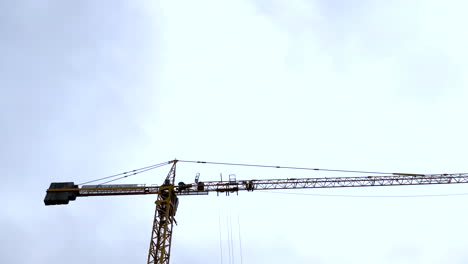 Crane-boom-against-the-sky,-construction-crane