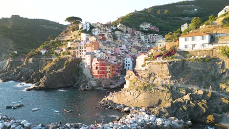 Riomaggiore,-Cinque-Terre---Aerial-Pullback-Reveal-during-Typical-Summer-Sunset