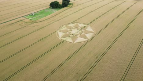 Aerial-view-towards-Micheldever-circular-crop-circle-pattern-on-golden-Hampshire-agricultural-wheat-filed