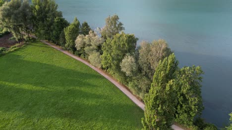 Grassy-plains-and-lakeside-in-Gäsi-Betlis,-Walensee-Glarus,-Weesen-Walenstadt,-Switzerland