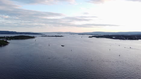 Scandinavian-Fjord-with-Small-Vessels,-Aerial-View,-Golden-Hour