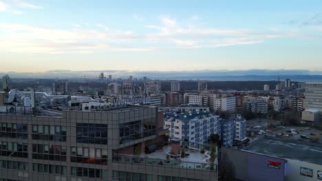 Drone-circling-around-Work-nomads-headquarters-against-the-backdrop-of-Vitosha-mountain-at-sunset