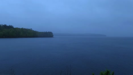 Beautiful,-atmospheric-summer-time-lapse-a-lake-in-the-Appalachian-mountains-during-a-stormy,-rainy-day-after-sunset