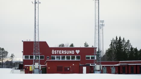 Tilt-down-from-sky-to-Östersund-skidstadion-building