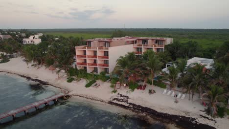 Orbit-shot-of-of-the-resort-at-Akiin-Beach,-Tulum,-Mexico_drone-view