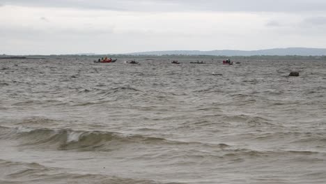 View-from-shore-of-currach-boat-racers-rounding-buoy-practicing-off-coast-of-galway