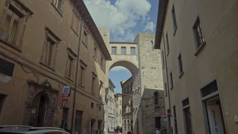 Walking-through-the-quiet-streets-of-the-old-walled-town-of-Volterra,-Province-of-Perugia,-Italy