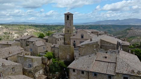 Aerial-over-the-hilltop-village-of-Civita-di-Bagnoregio,-Province-of-Viterbo,-Italy