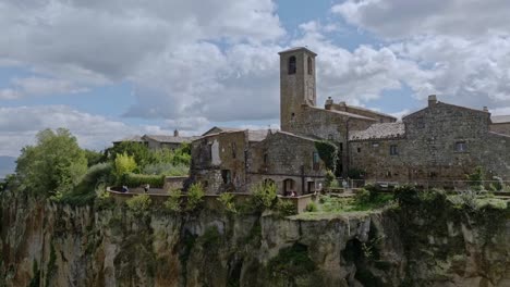 Aerial-over-the-hilltop-village-of-Civita-di-Bagnoregio,-Province-of-Viterbo,-Italy