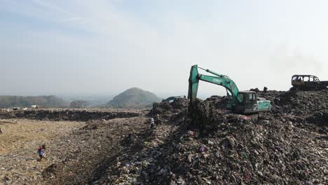 Aerial-view,-huge-mountains-of-garbage-piled-up-at-the-Piyungan-landfill,-Yogyakarta